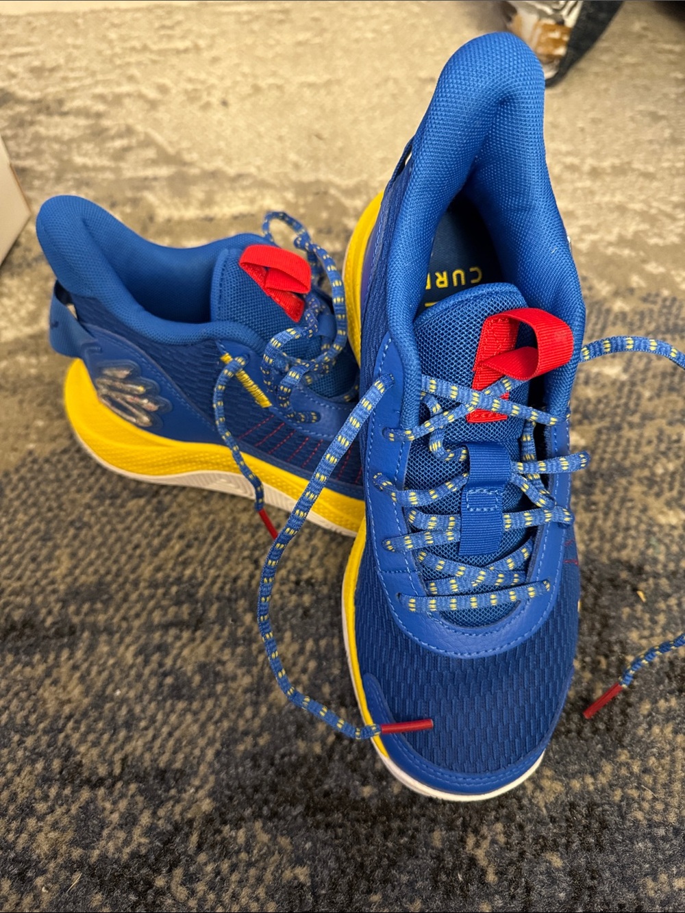 Under Armour Kids Blue and Yellow Sneakers with Red Accents